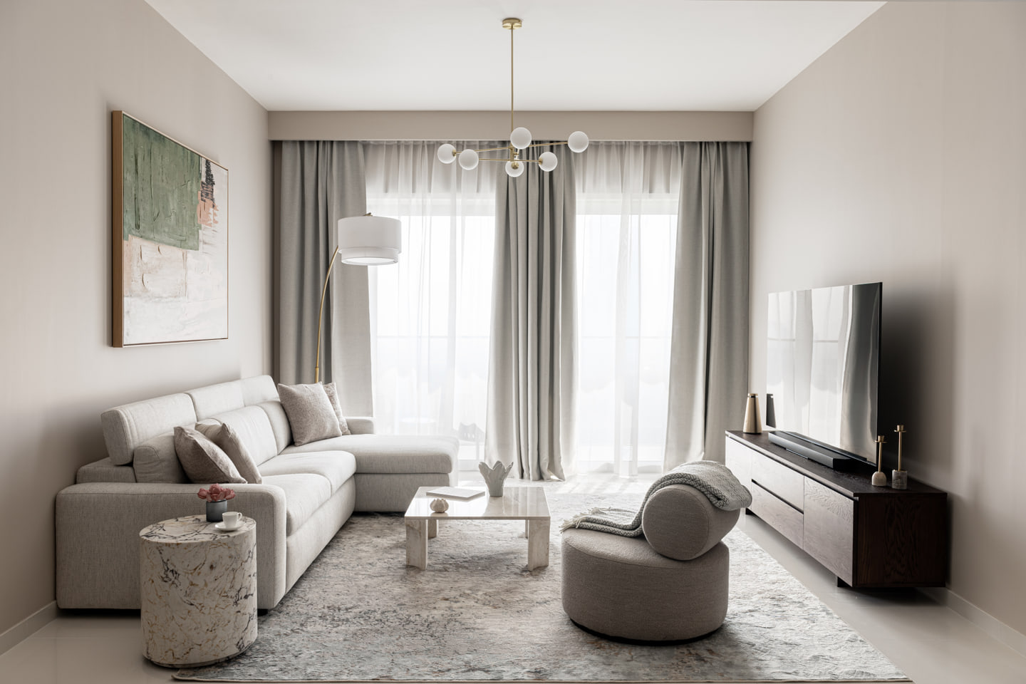 Wide living room view with curved armchair, sectional sofa and dark timber media unit