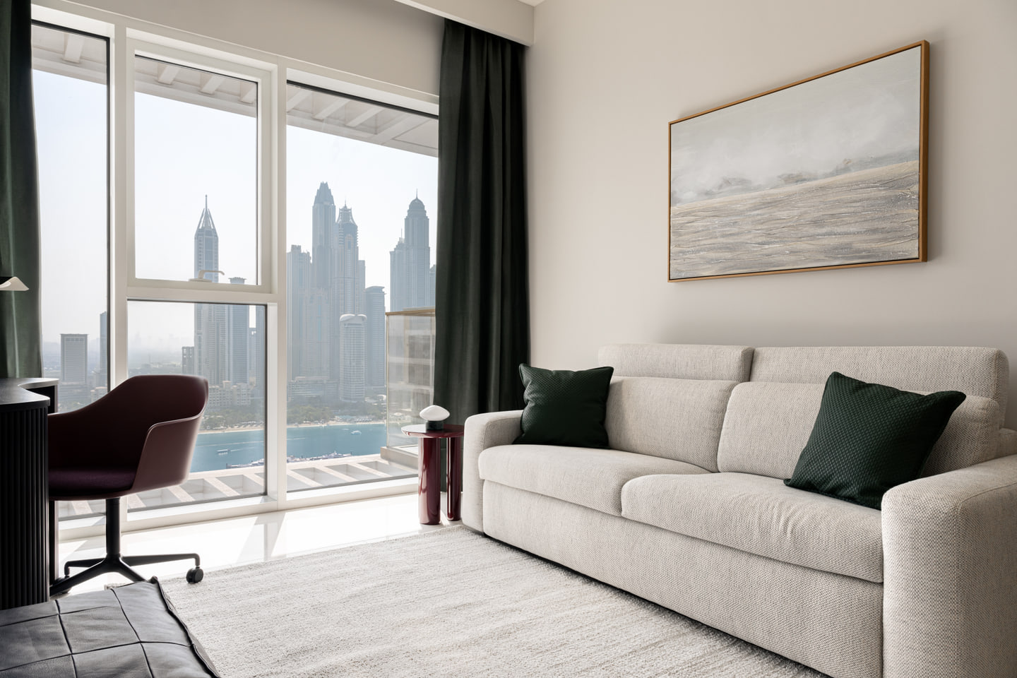 Home office and sofa set against the Dubai skyline