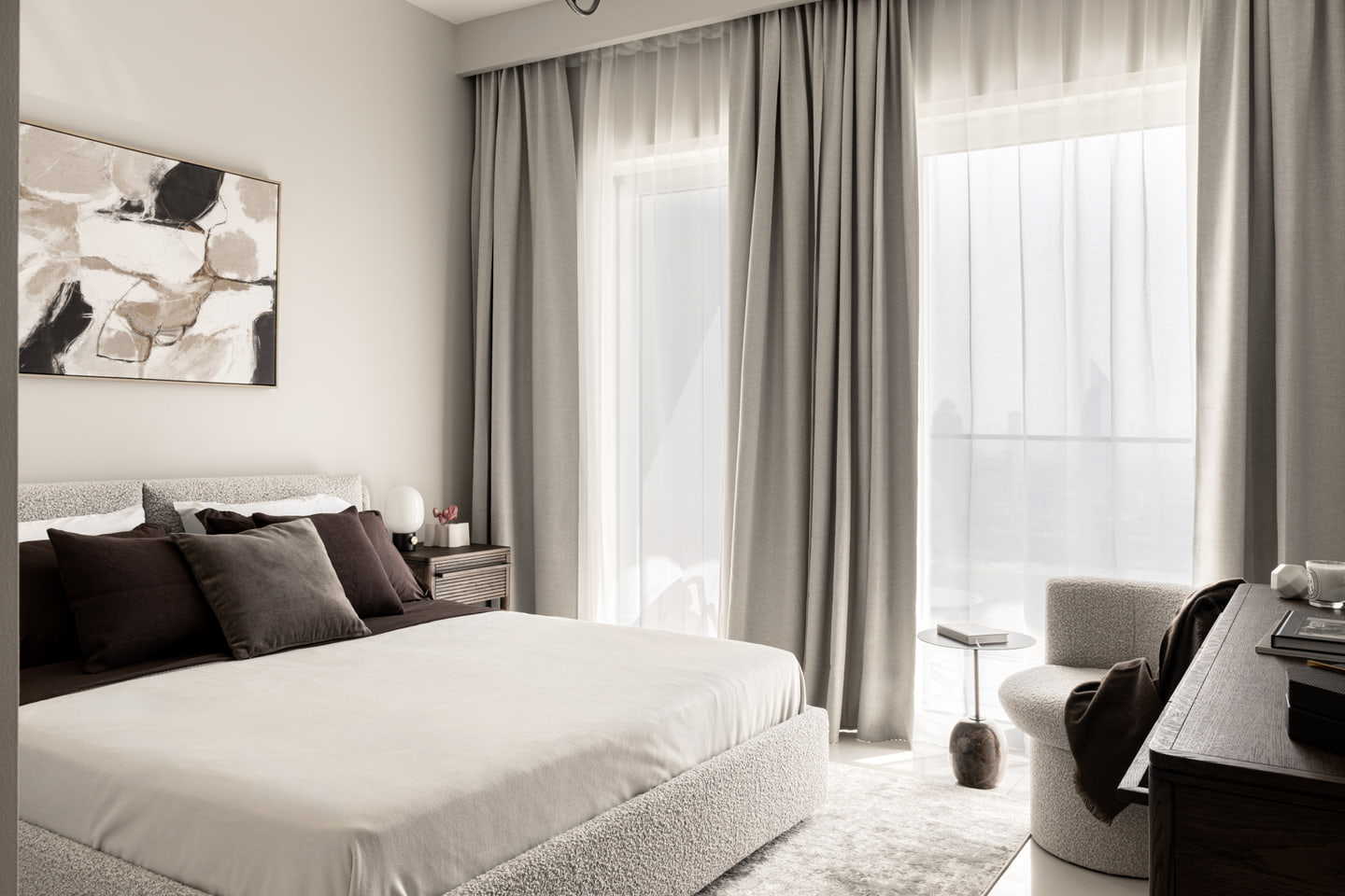 Bedroom with dark timber, layered neutral bedding and soft daylight