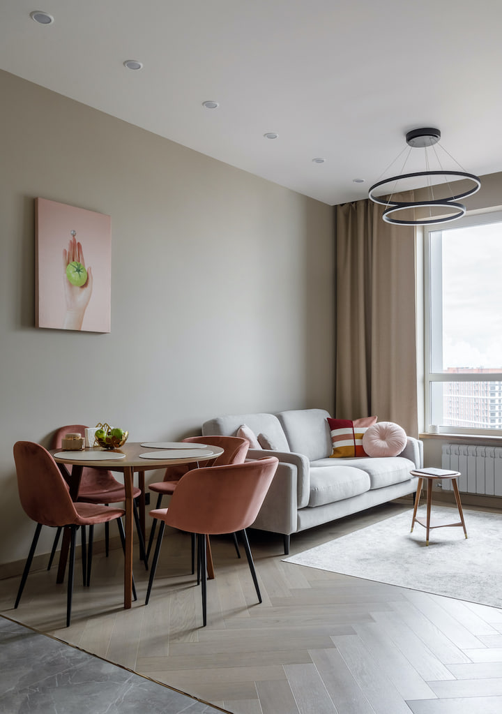 Living and dining room with dusty rose chairs