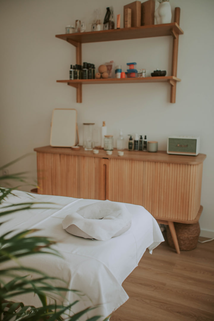 Treatment room with timber storage and softly layered objects