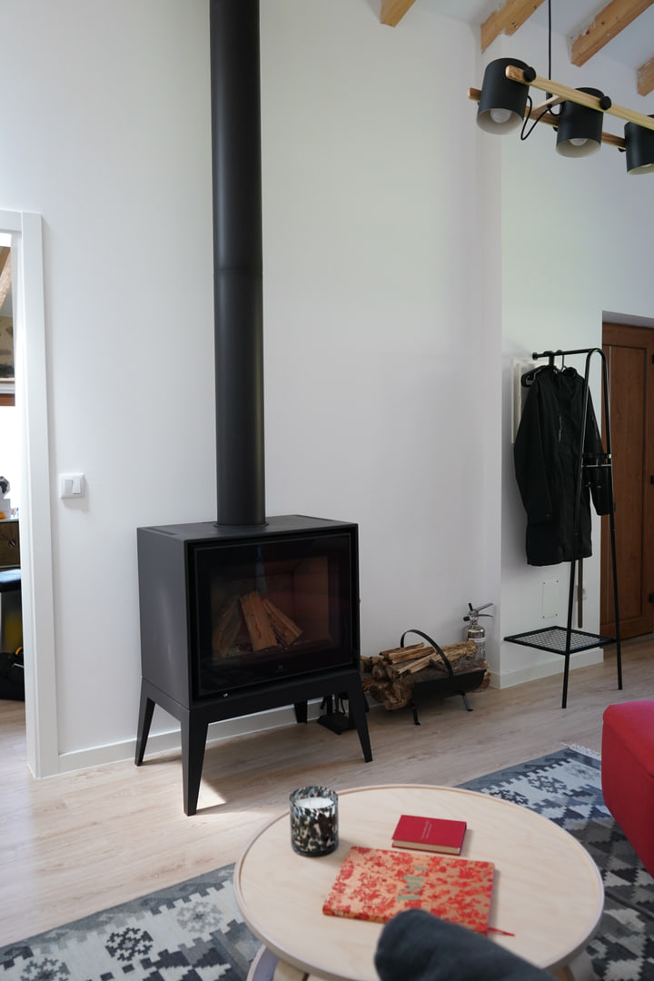 Black stove beside the compact living area